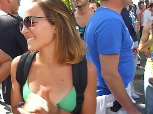 Fuckable shorty dances on the street in a bikini top