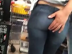He plays with her ass in the store