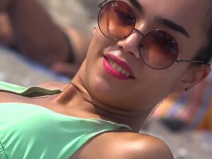 Peeping on two hot friends chilling on the beach